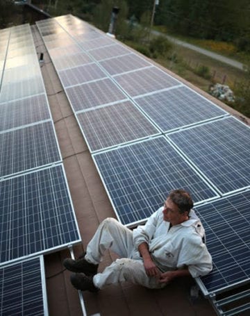 Worker rests during construction of Solar Array in Hudson's Hope